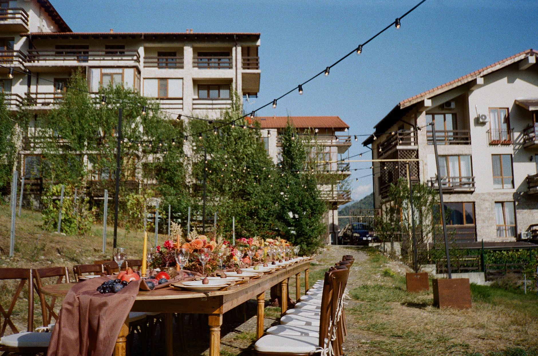 Outdoor dining flowers string lights